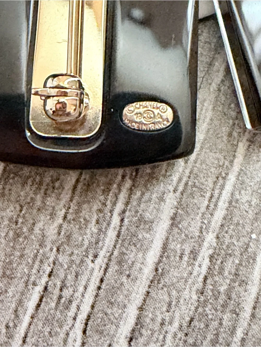 CHANEL Black & White Striped Sweater Pin with Gold CC